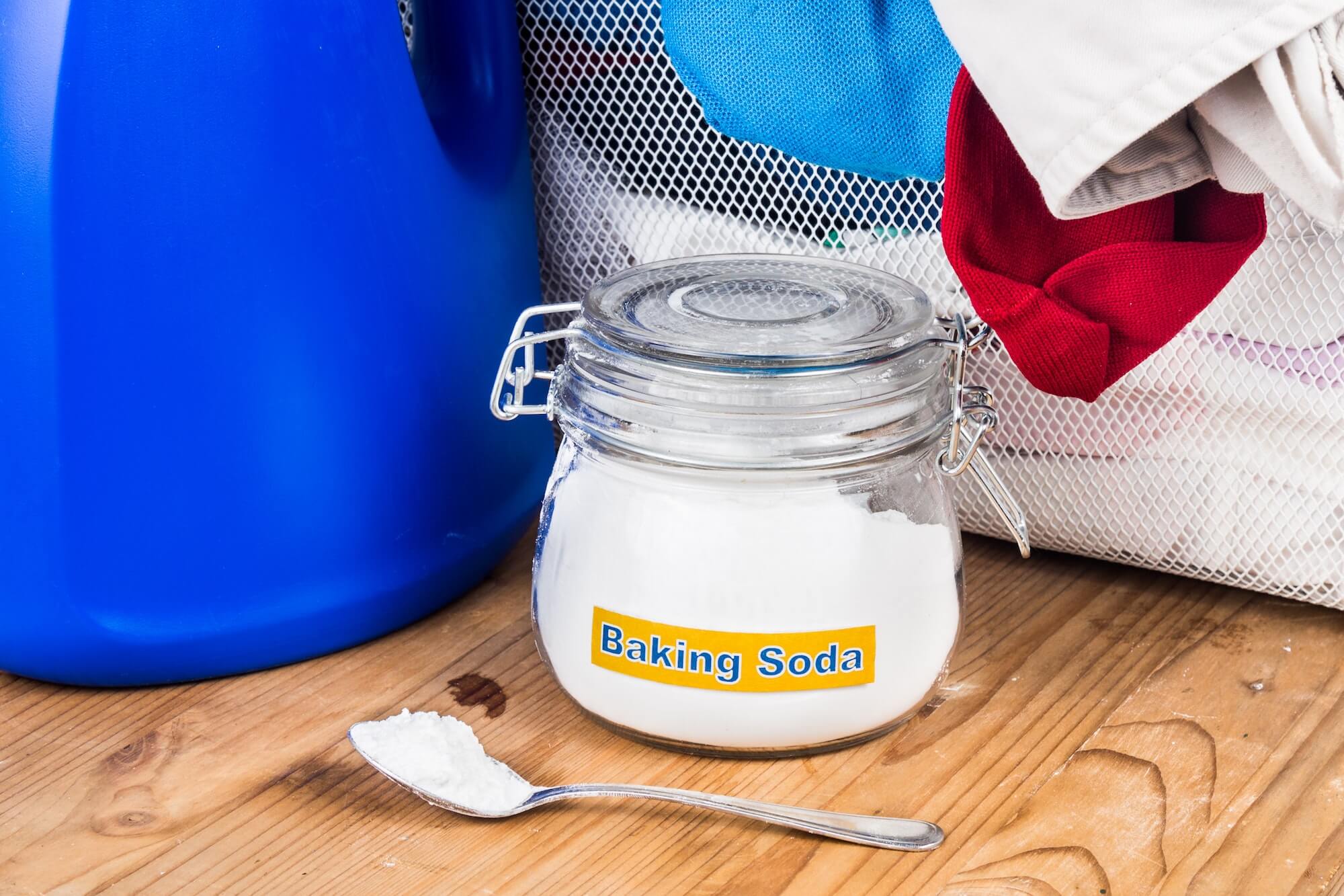 Baking soda with detergent and pile of dirty laundry. Baking soda with detergent and pile of dirty laundry.